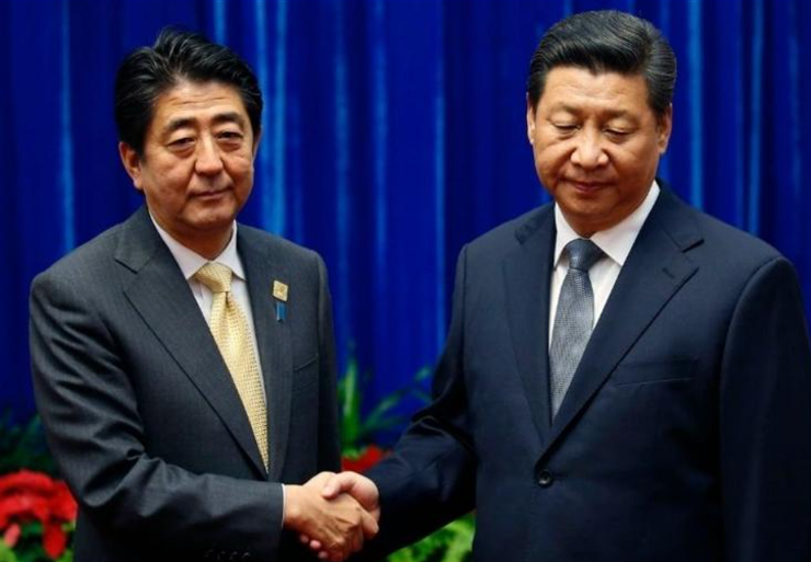 安倍晉三與習近平在2014年見面時,臭臉相對,已預示美中關係將快速走下坡!